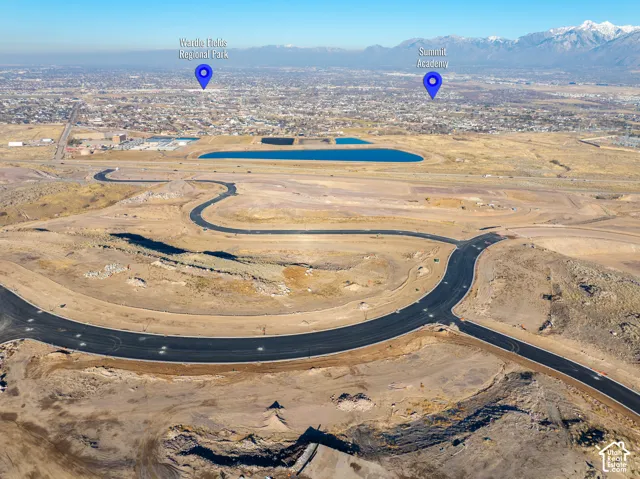 Developed subdivision featuring paved roads and visible water features