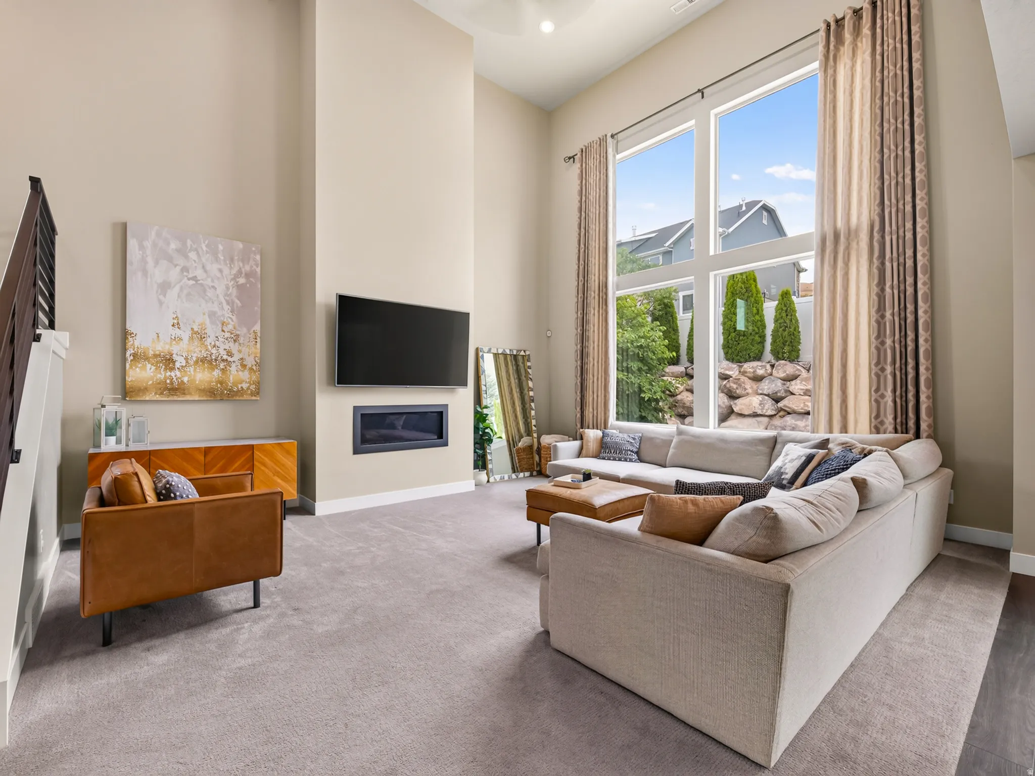 Family room has cathedral ceiling and large windows
