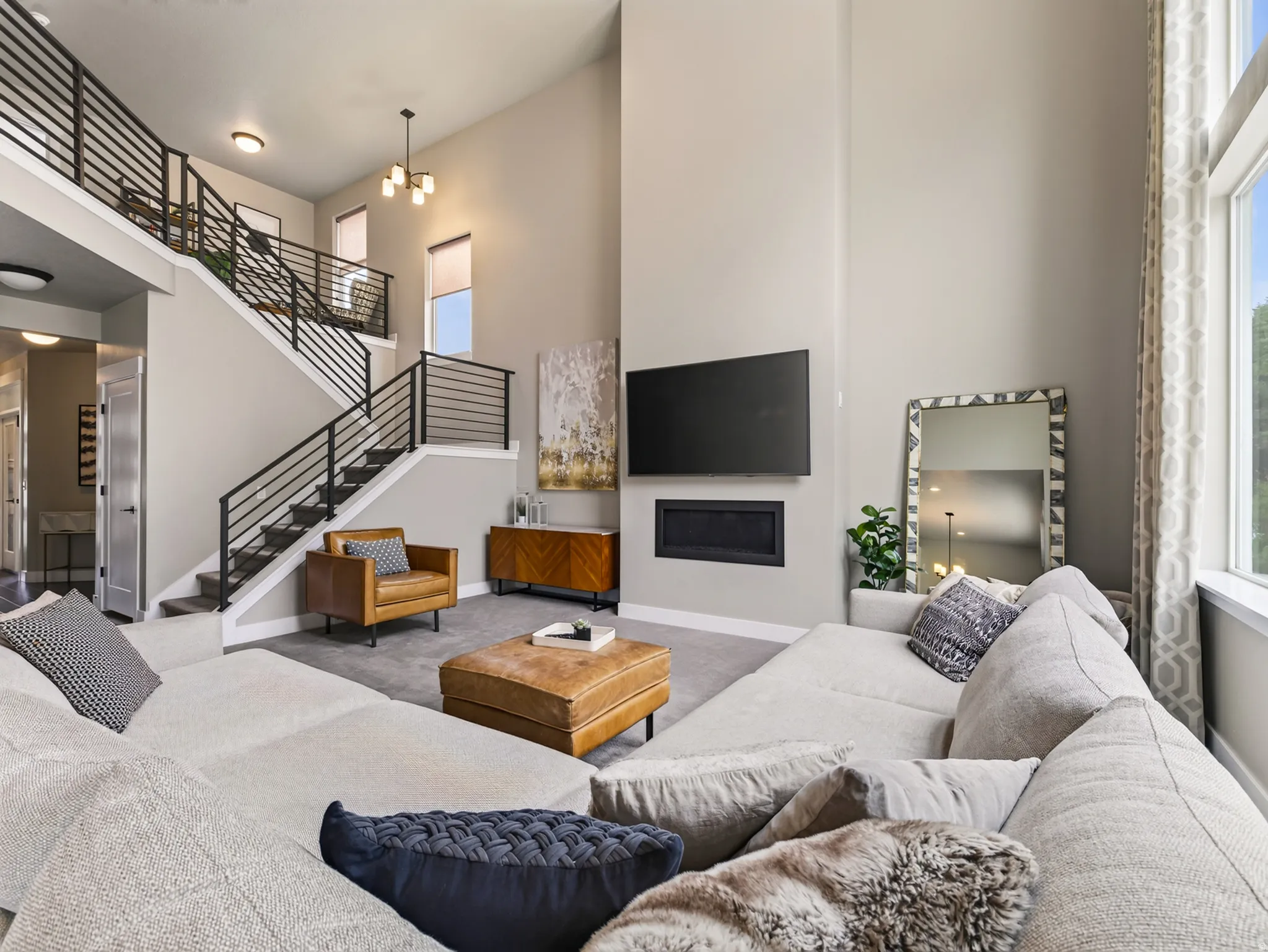 Soaring ceiling heights create an expansive living area