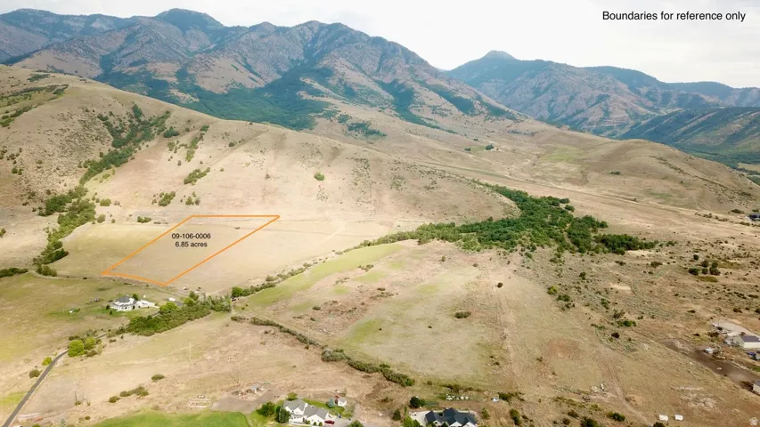 Expansive 6.85-acre parcel with surrounding mountain ranges and varied topography