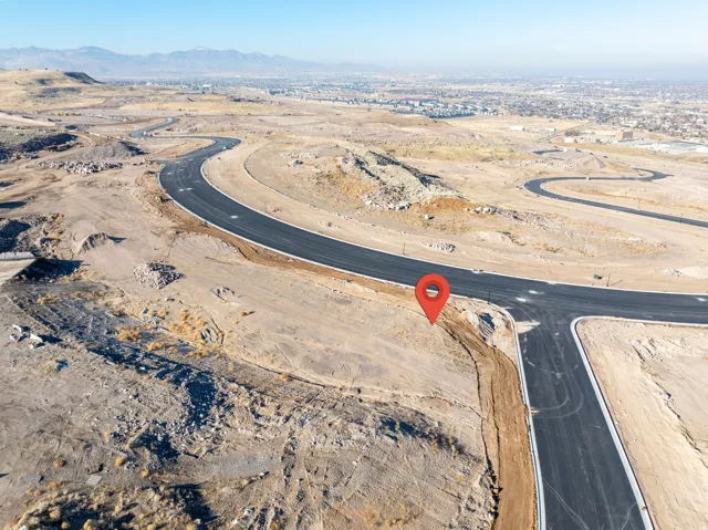 Expansive undeveloped parcel featuring newly paved roadways and a broad land area