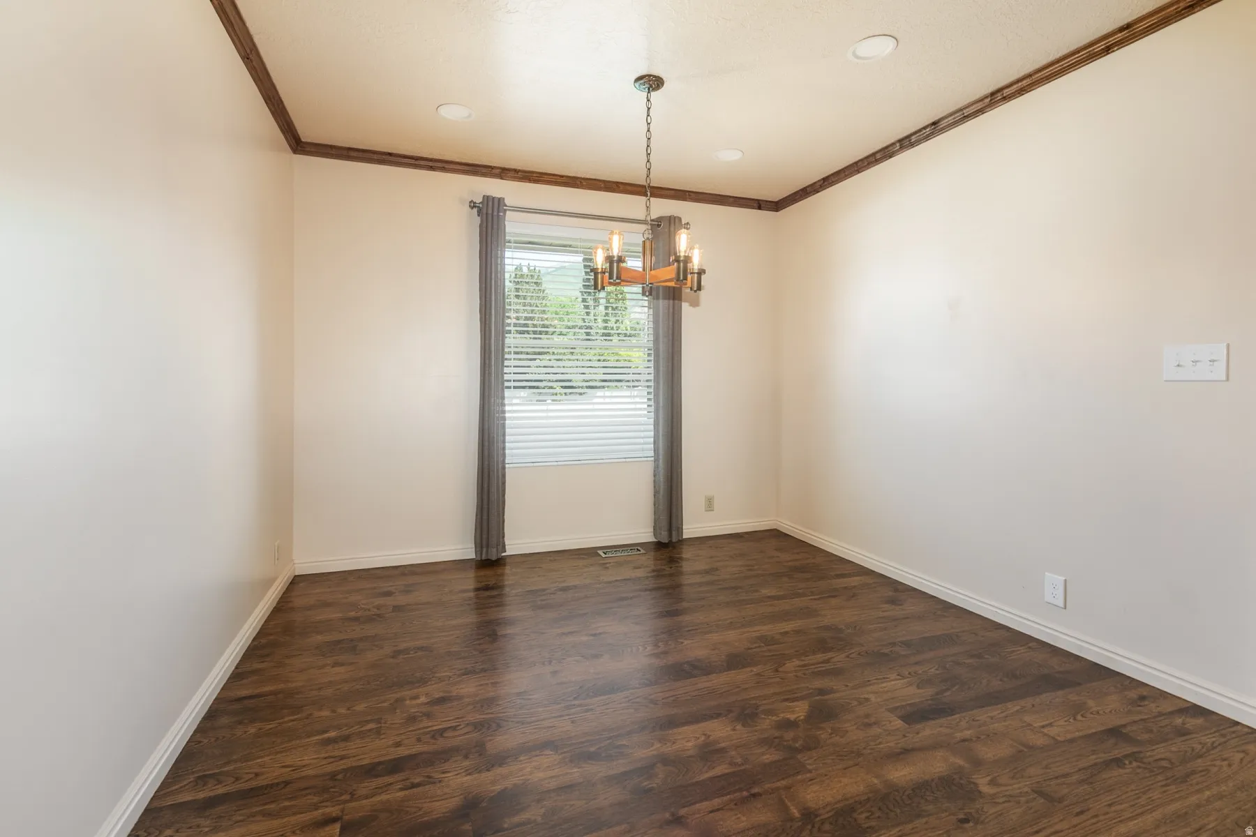 Dining area with wood flooring.