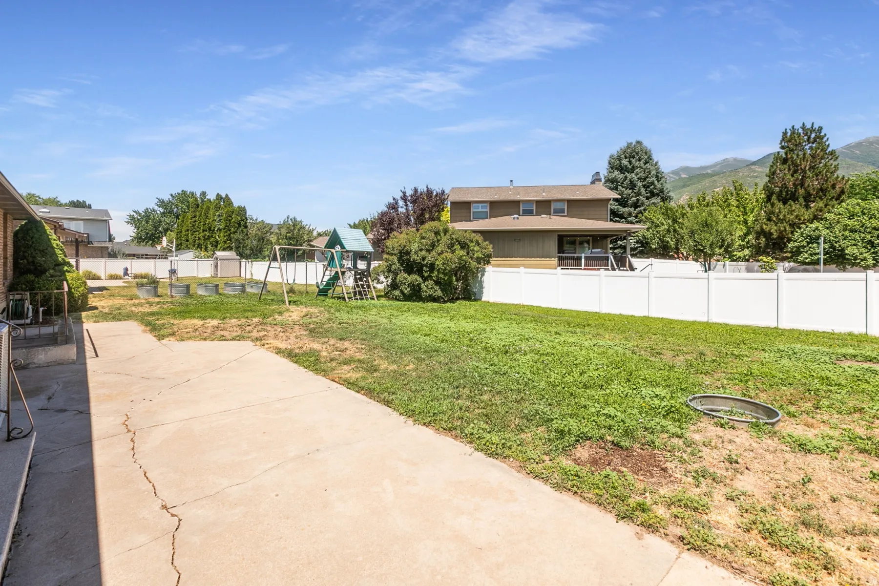 Fenced yard with large patio.