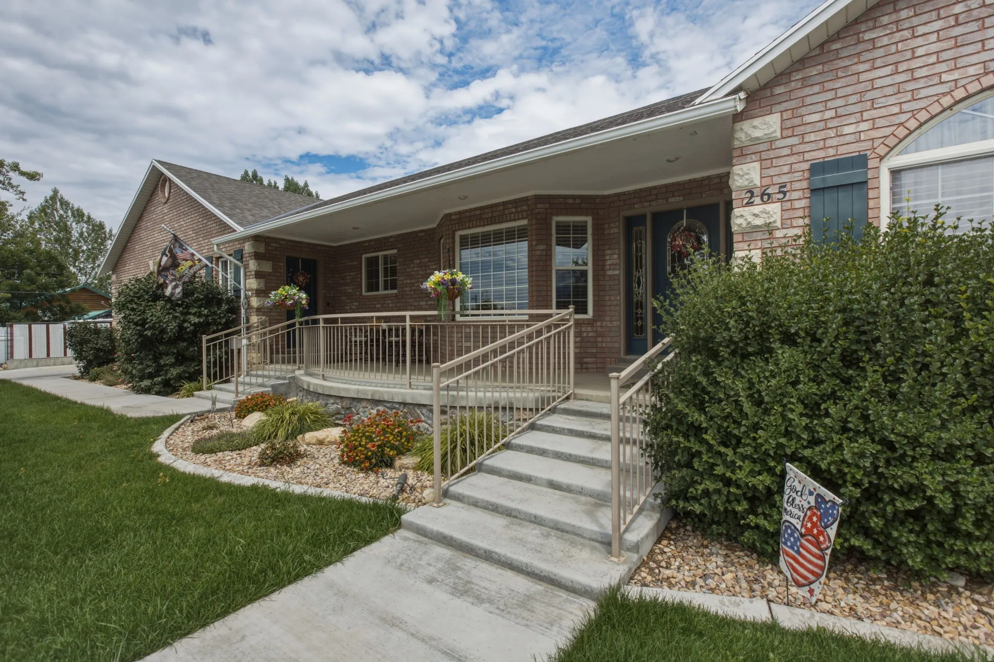 Brick exterior with stone accents and an arched window