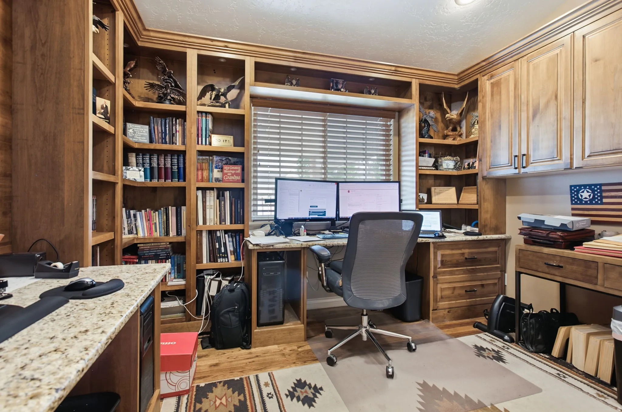 Built-in wood cabinetry and shelving define this dedicated workspace