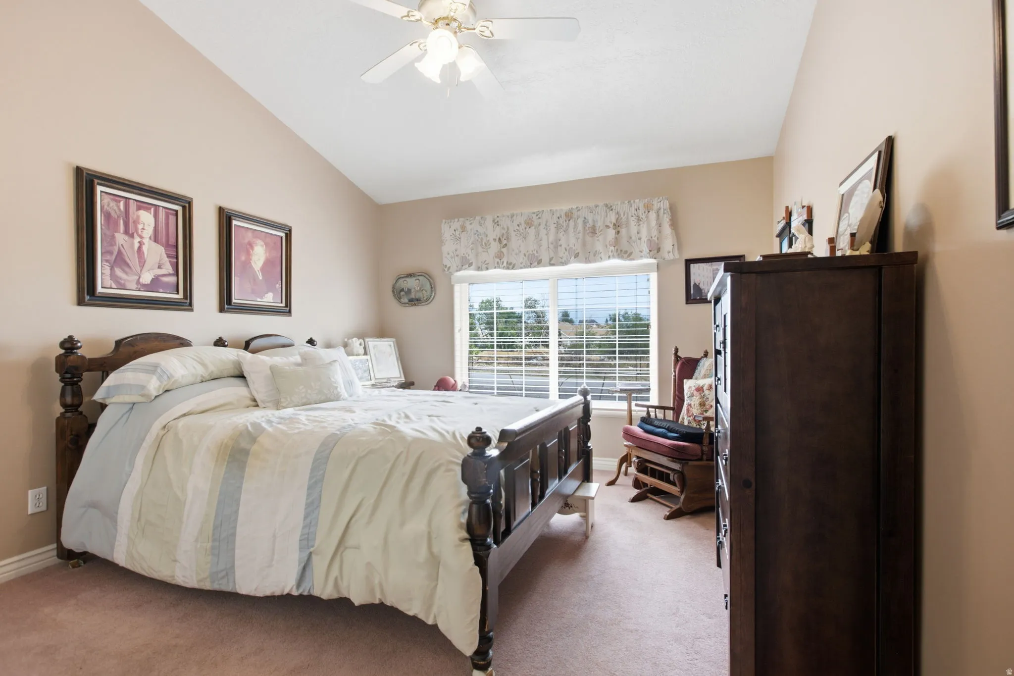 Interior room featuring a vaulted ceiling with a ceiling fan