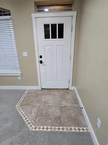 White paneled door with integrated window panels