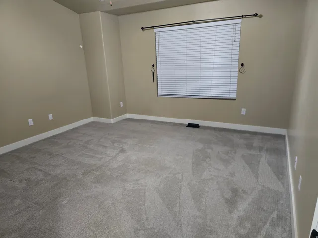 Spacious interior with neutral wall tones and white trim