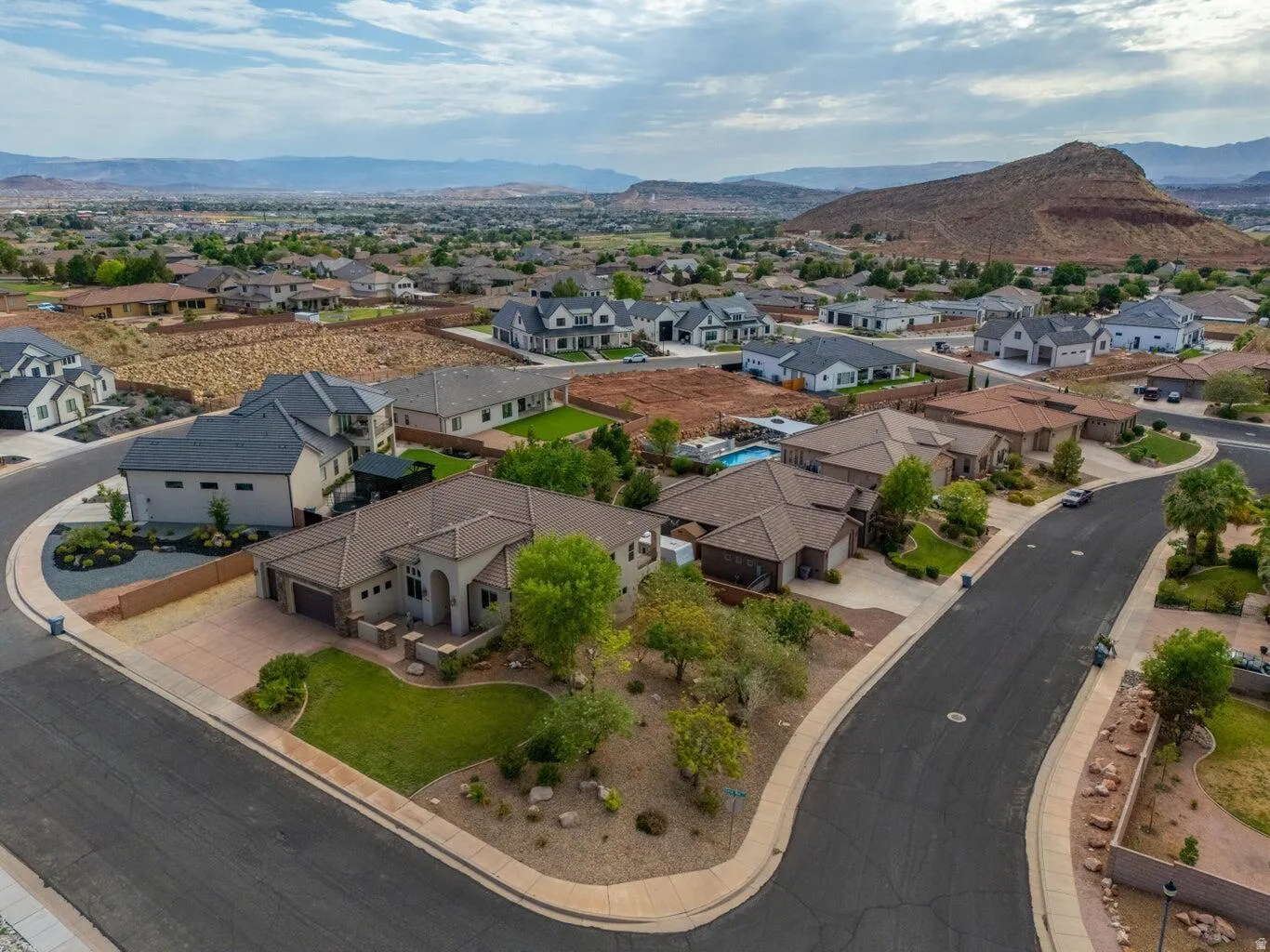 Expansive neighborhood featuring varied architectural styles and mature desert landscaping