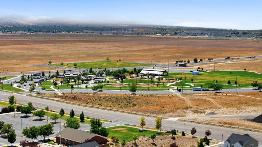 Expansive community grounds featuring a recreation park with multiple sports fields and a structured pavilion