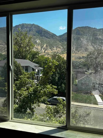 Mountainous terrain visible through a framed window