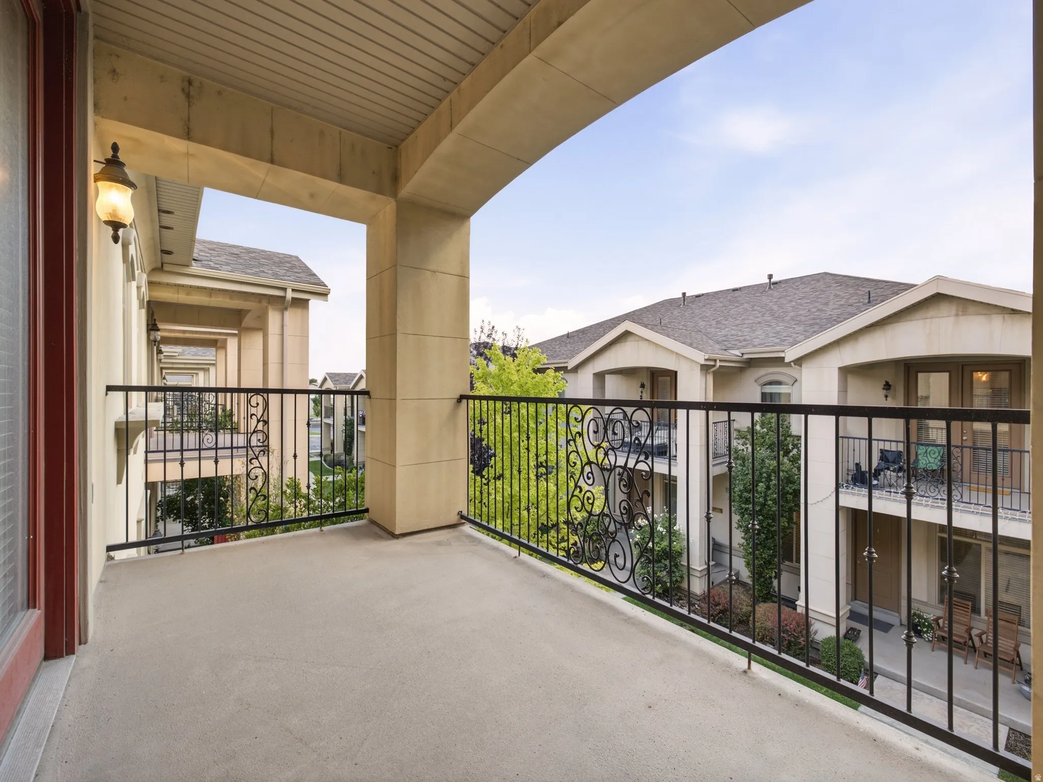 Covered outdoor balcony with a concrete surface