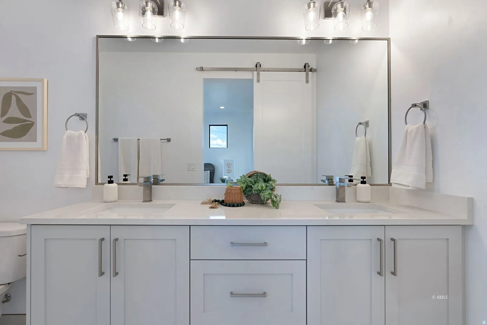Dual vanity with integrated sinks, quartz countertop, and brushed nickel hardware