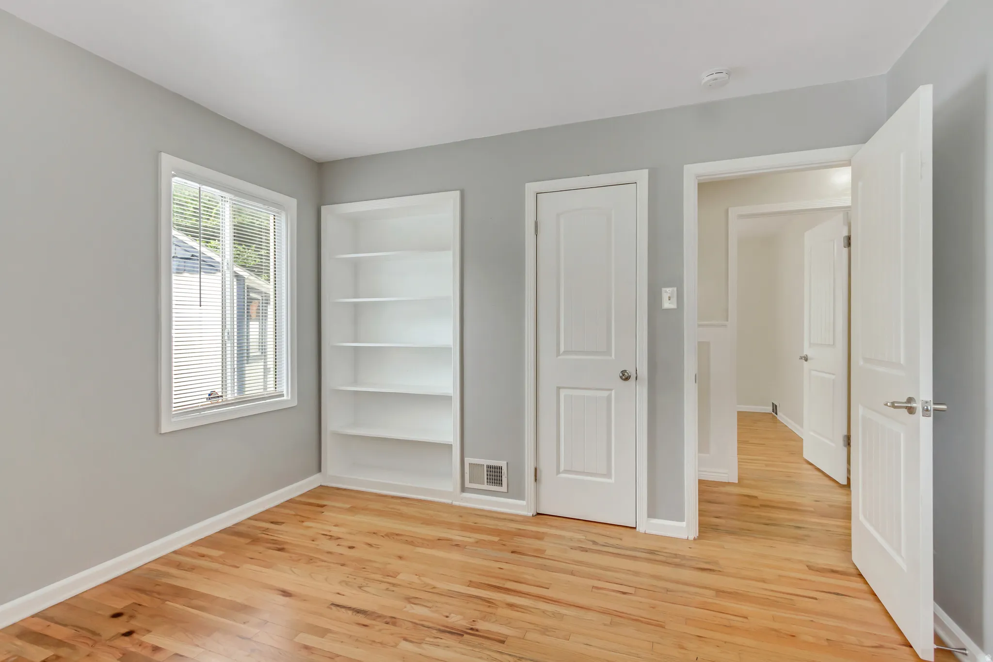 Light gray interior paint with wood-finish flooring
