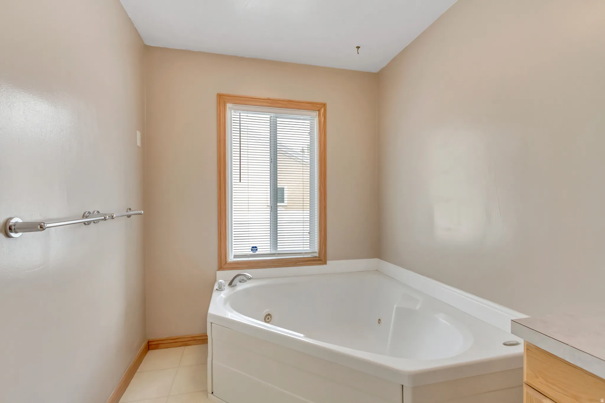 Spacious soaking tub with a corner placement