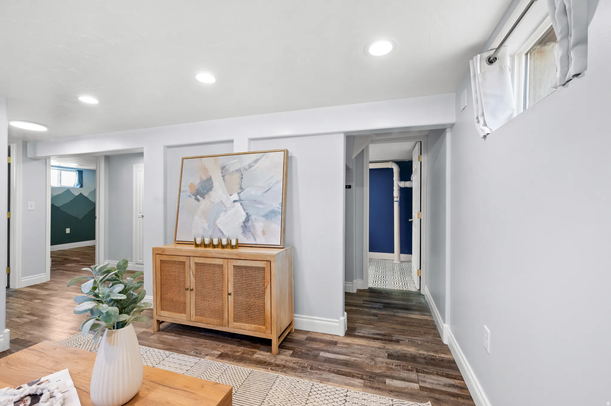 Light gray walls complemented by wood-finish flooring