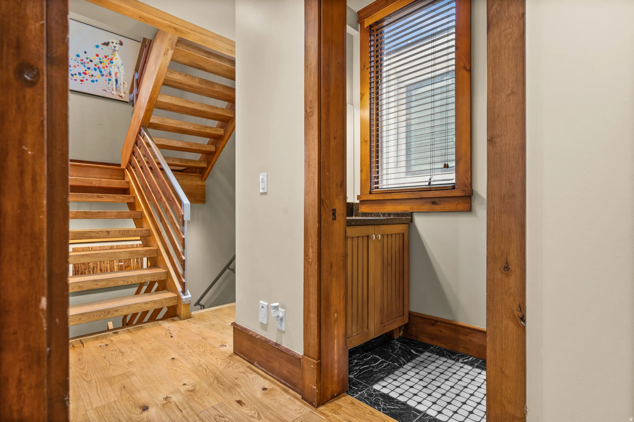 Hardwood staircase featuring wood treads and metal balusters