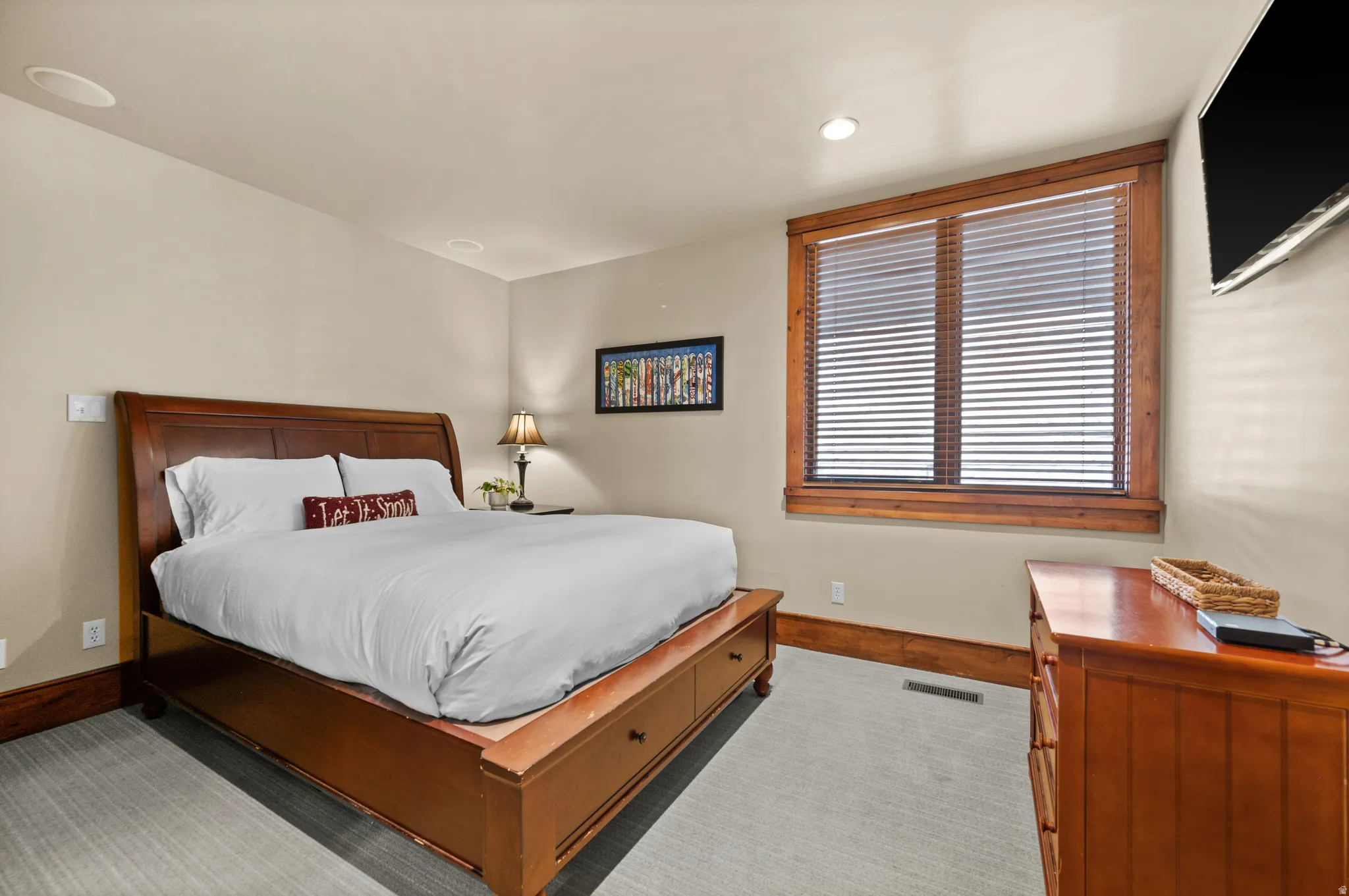 Neutral-toned walls complement rich wood trim and window frames