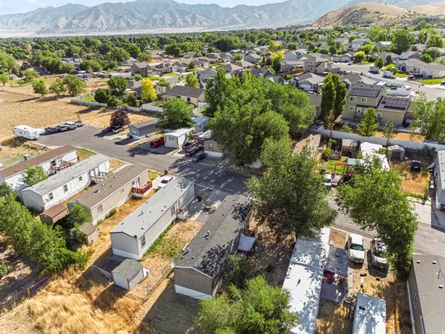 Aerial perspective showcasing a residential community with varied housing styles and mature trees