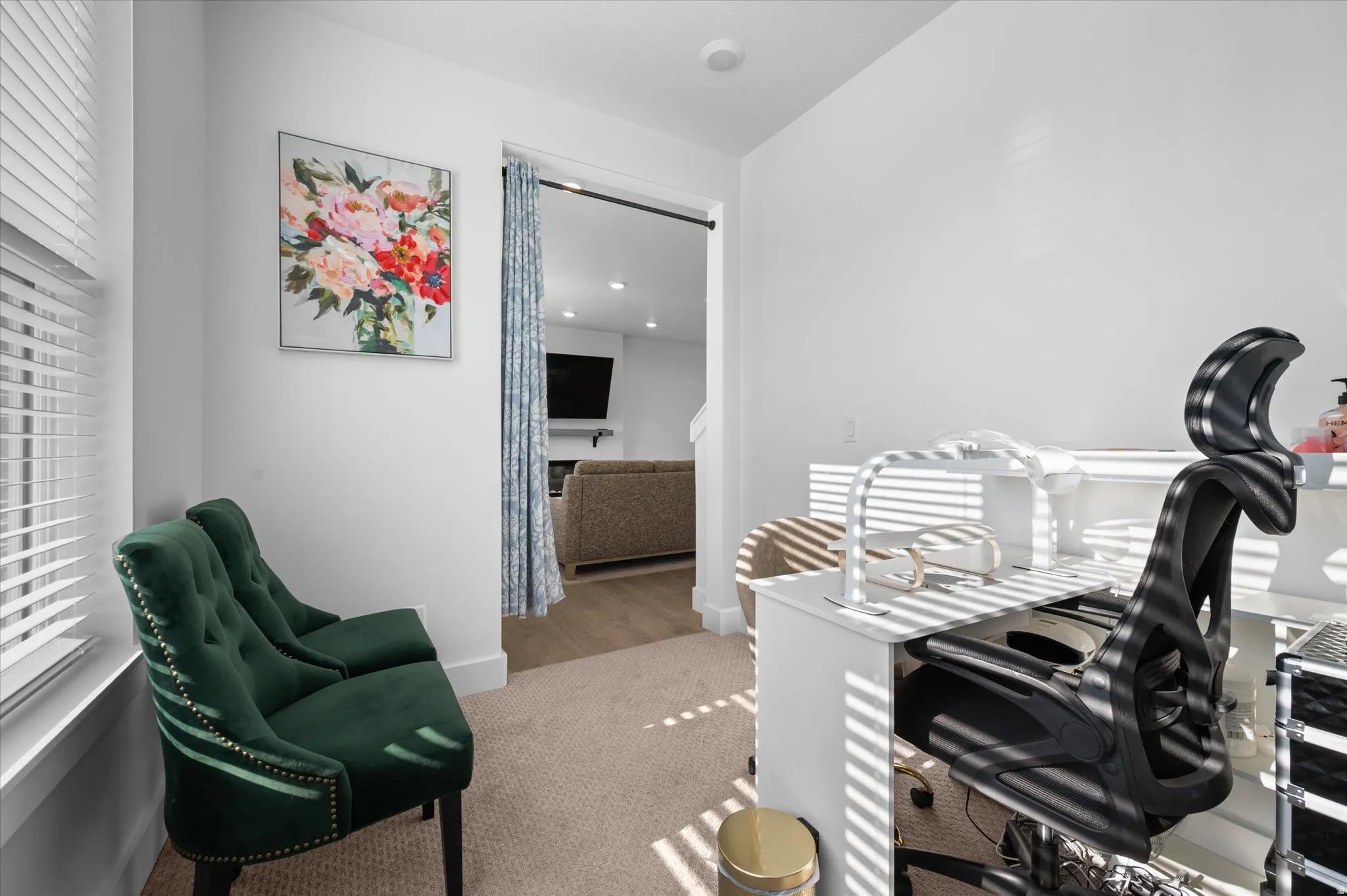 Interior space featuring white walls and neutral-toned carpeting