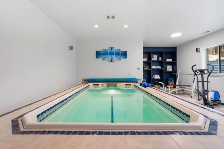 Train like a champion in your private, dedicated wellness studio. The heated indoor swim spa offers year-round training, hydrotherapy, and relaxation.