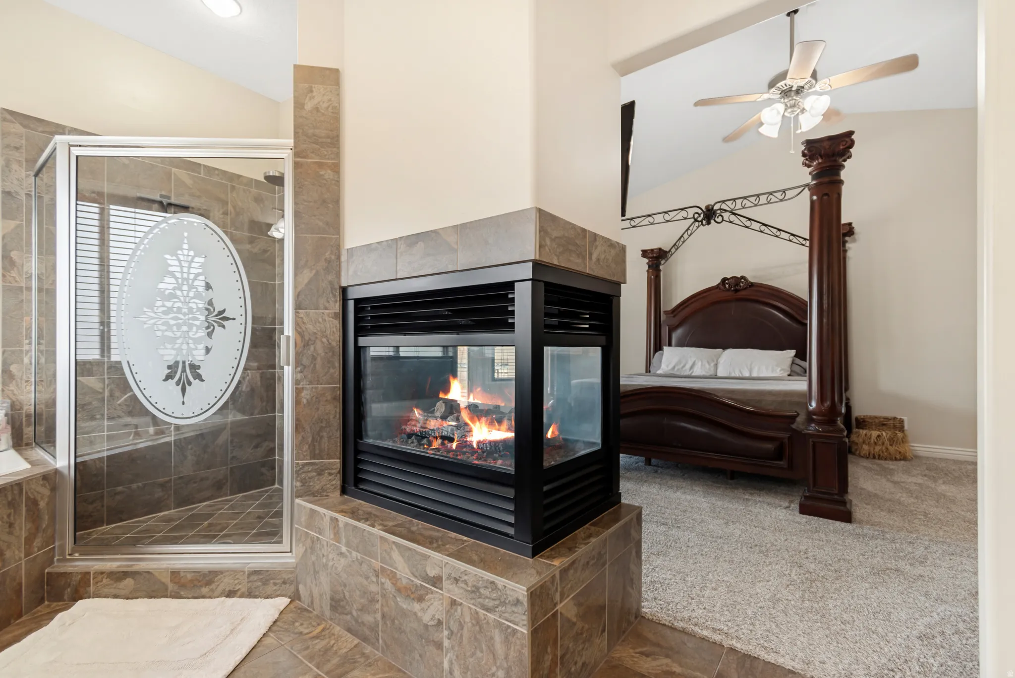 Two-sided fireplace featuring a tiled surround and hearth