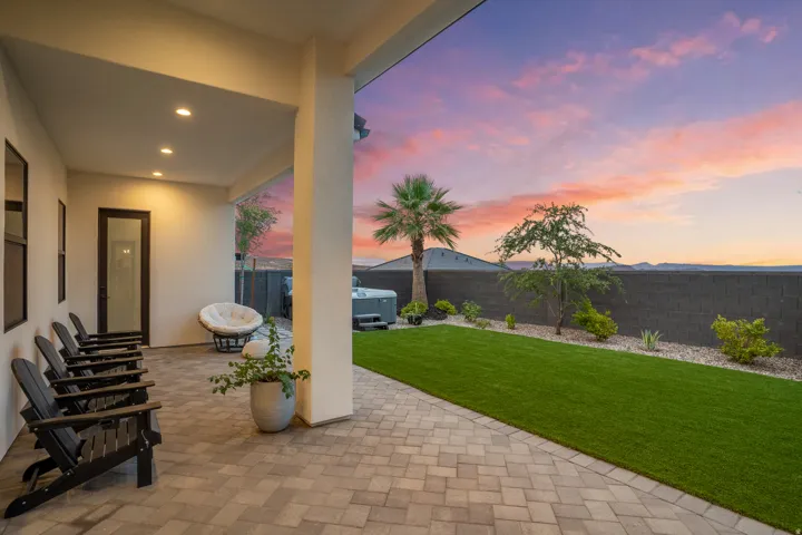 Covered patio featuring paver flooring and recessed lighting