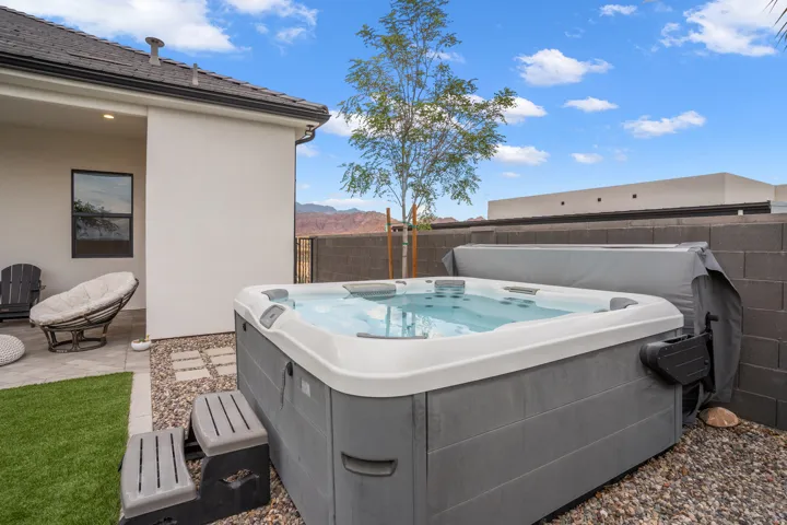 Outdoor spa featuring integrated steps