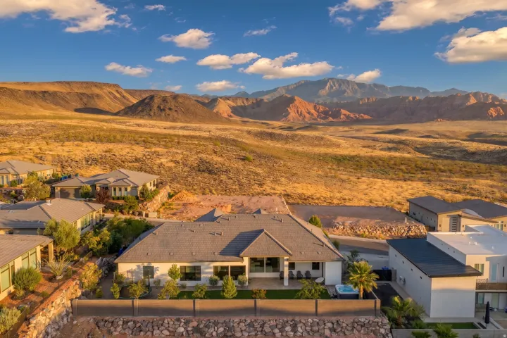 Contemporary residence featuring a private patio, outdoor spa, and desert landscaping