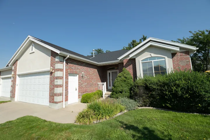 Brick and stucco exterior with multiple gables