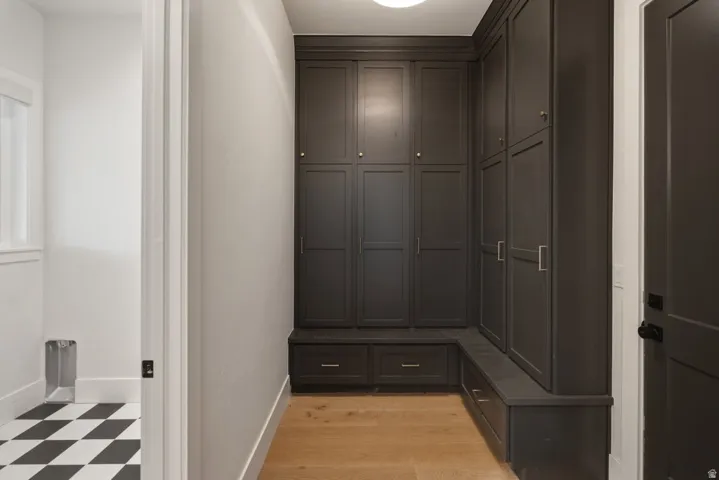 Built-in dark cabinetry featuring panel-front doors and brushed nickel hardware