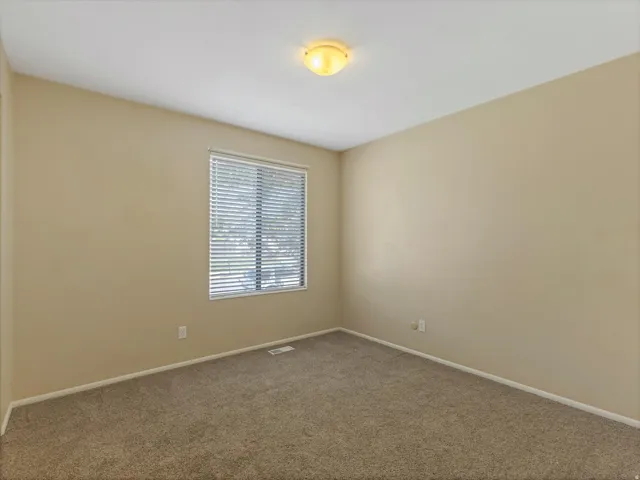 Neutral-toned wall paint and matching carpet