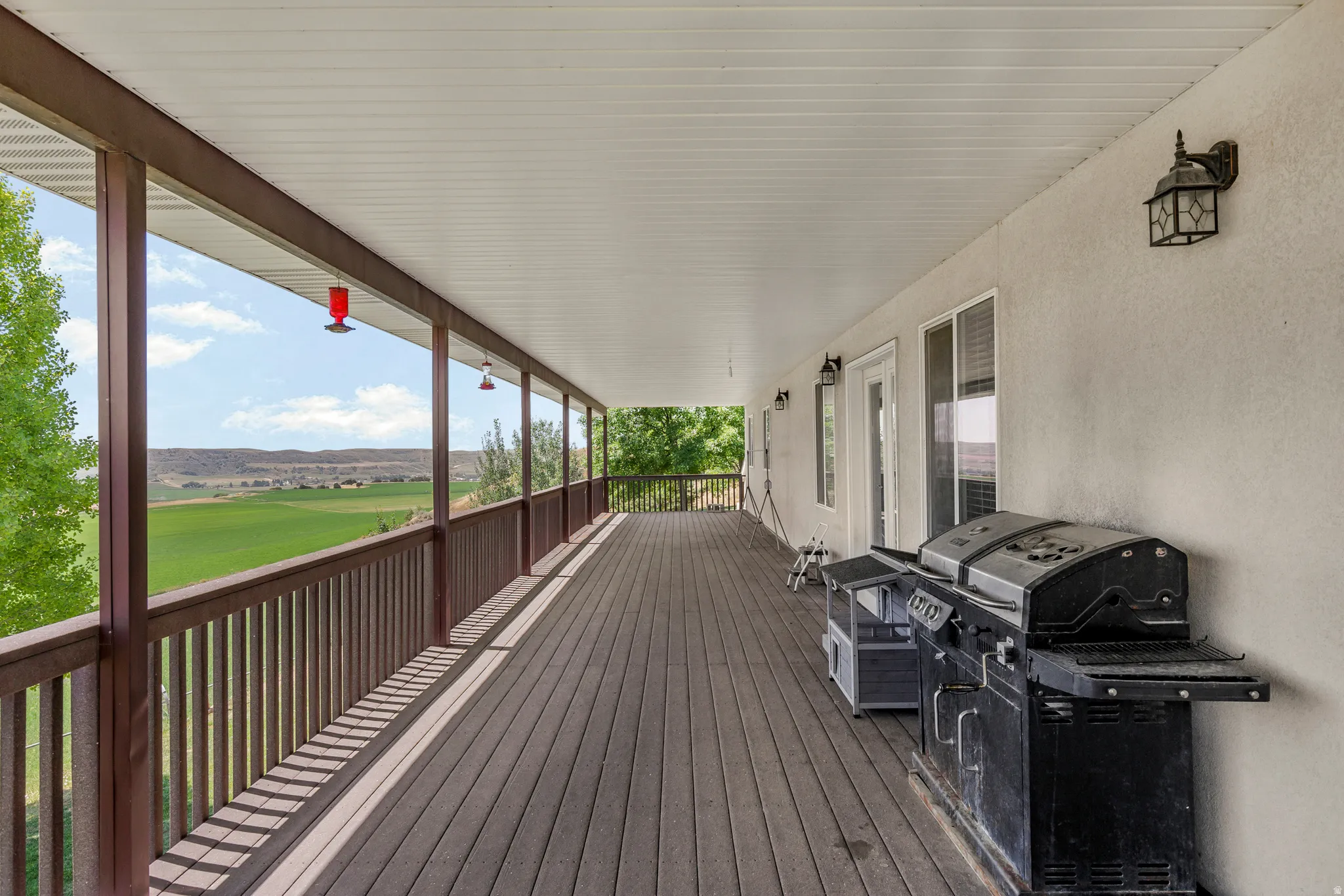 Covered deck extends length of house