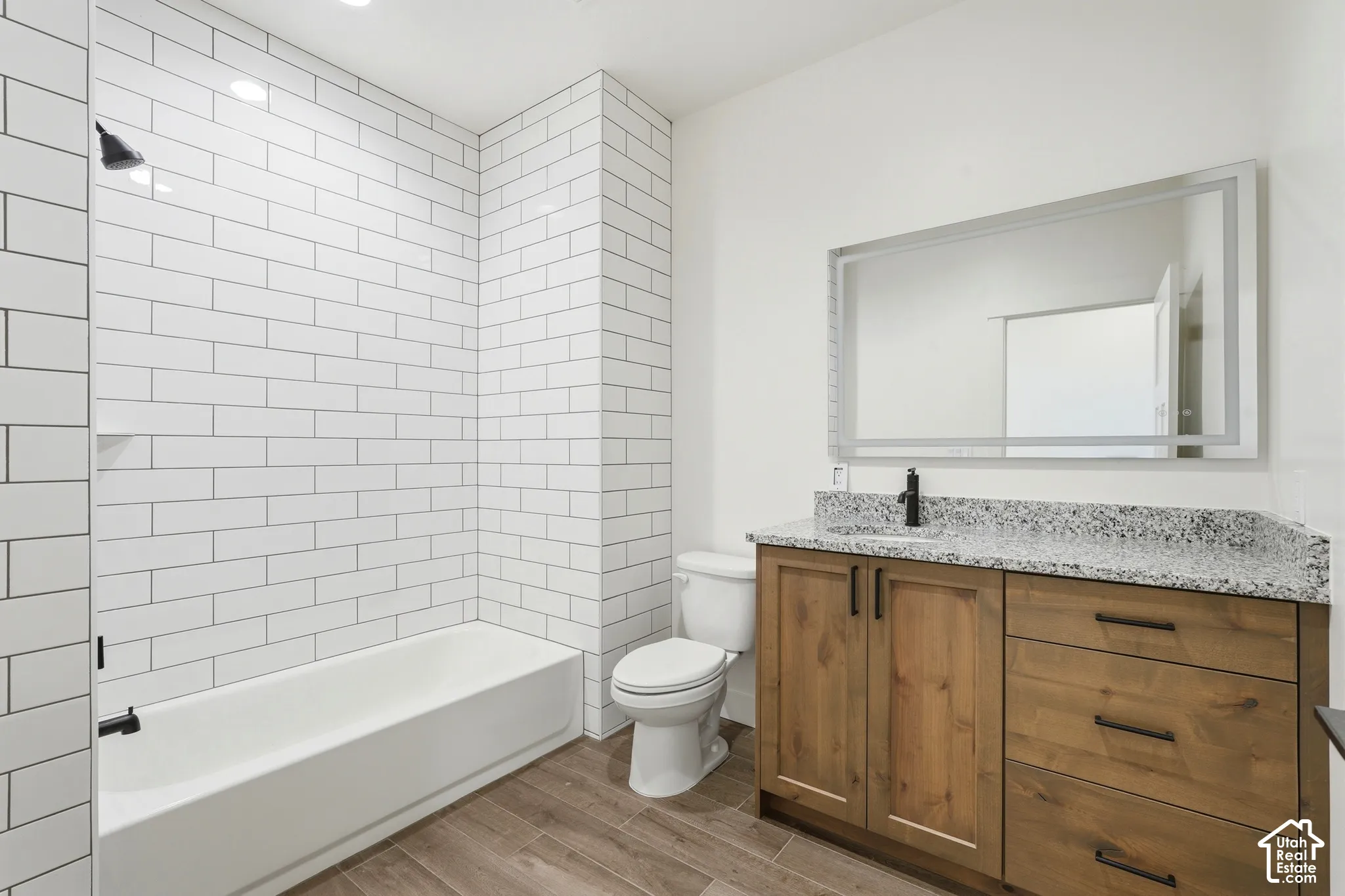 White subway tile shower surround with integrated shelf
