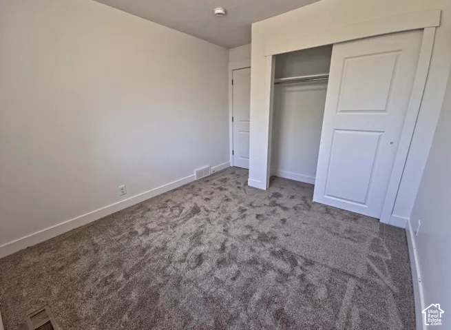 Neutral-toned carpeting paired with crisp white walls