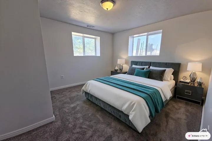 Carpeted flooring, gray walls, and a ceiling-mounted light fixture