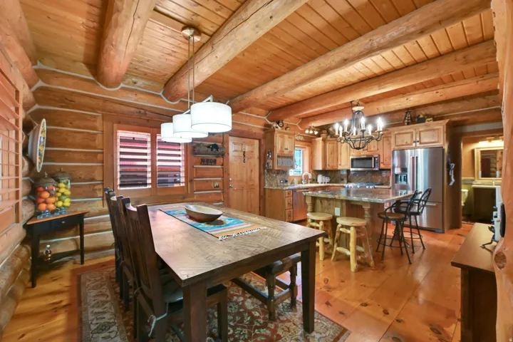 Expansive open-concept room featuring a dining area and kitchen