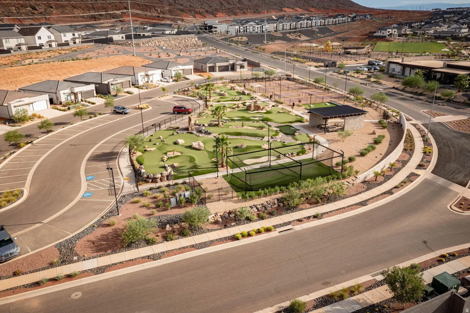 Community amenities featuring a miniature golf course, tennis courts, and a covered pavilion