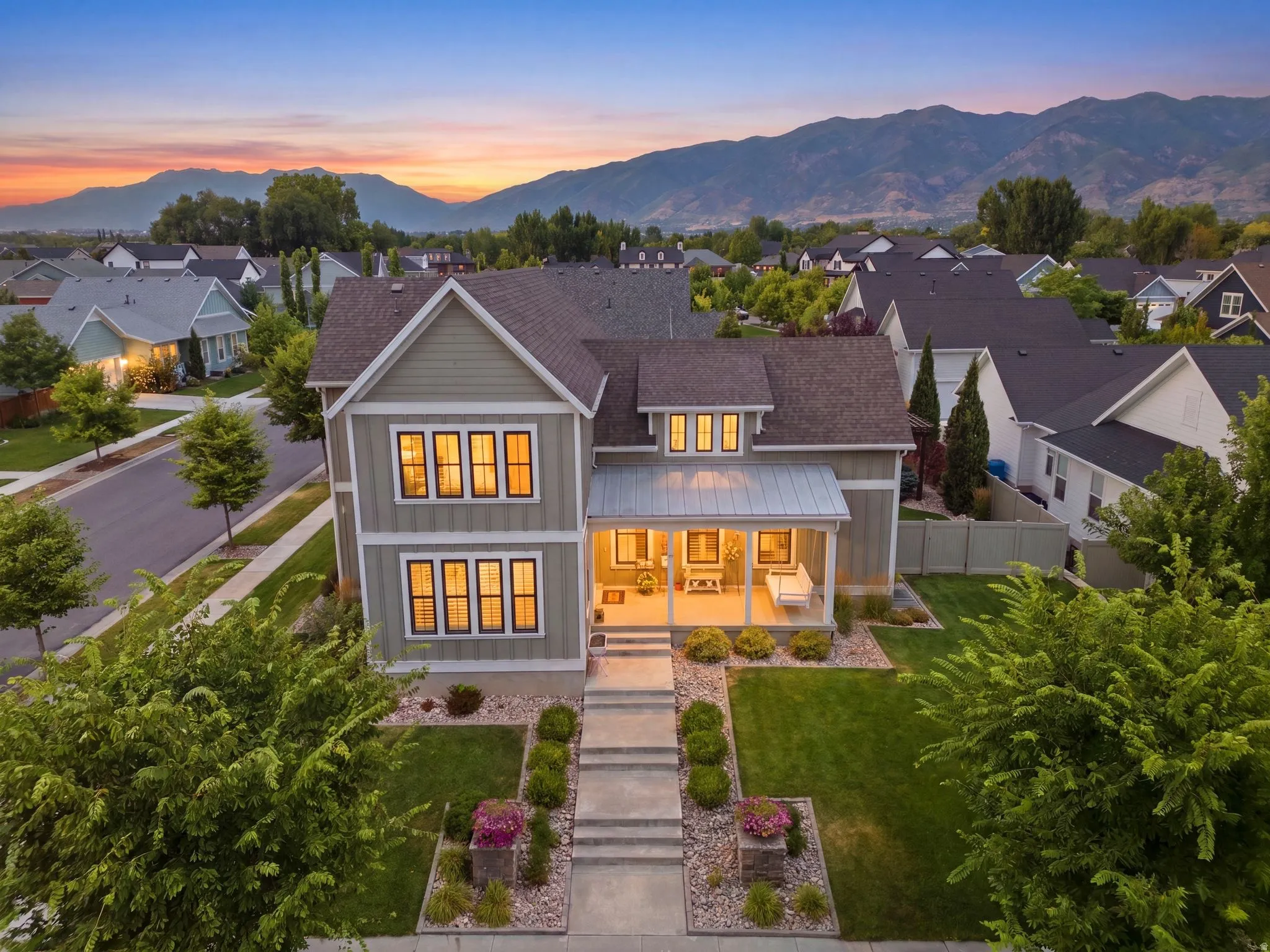 Craftsman-style featuring a cozy covered front porch and beautiful yard