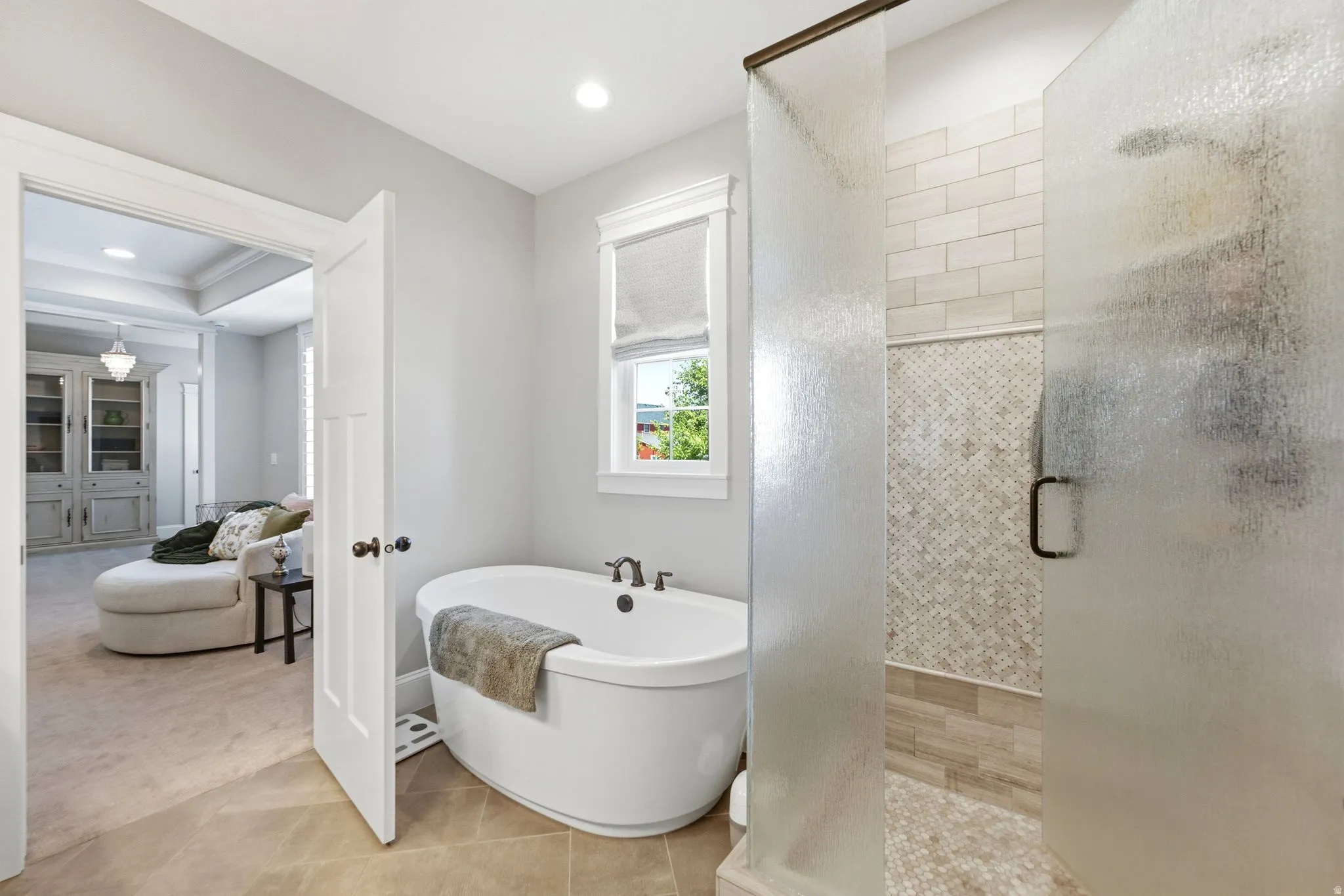 Primary en-suite with spacious soaking tub and separate shower