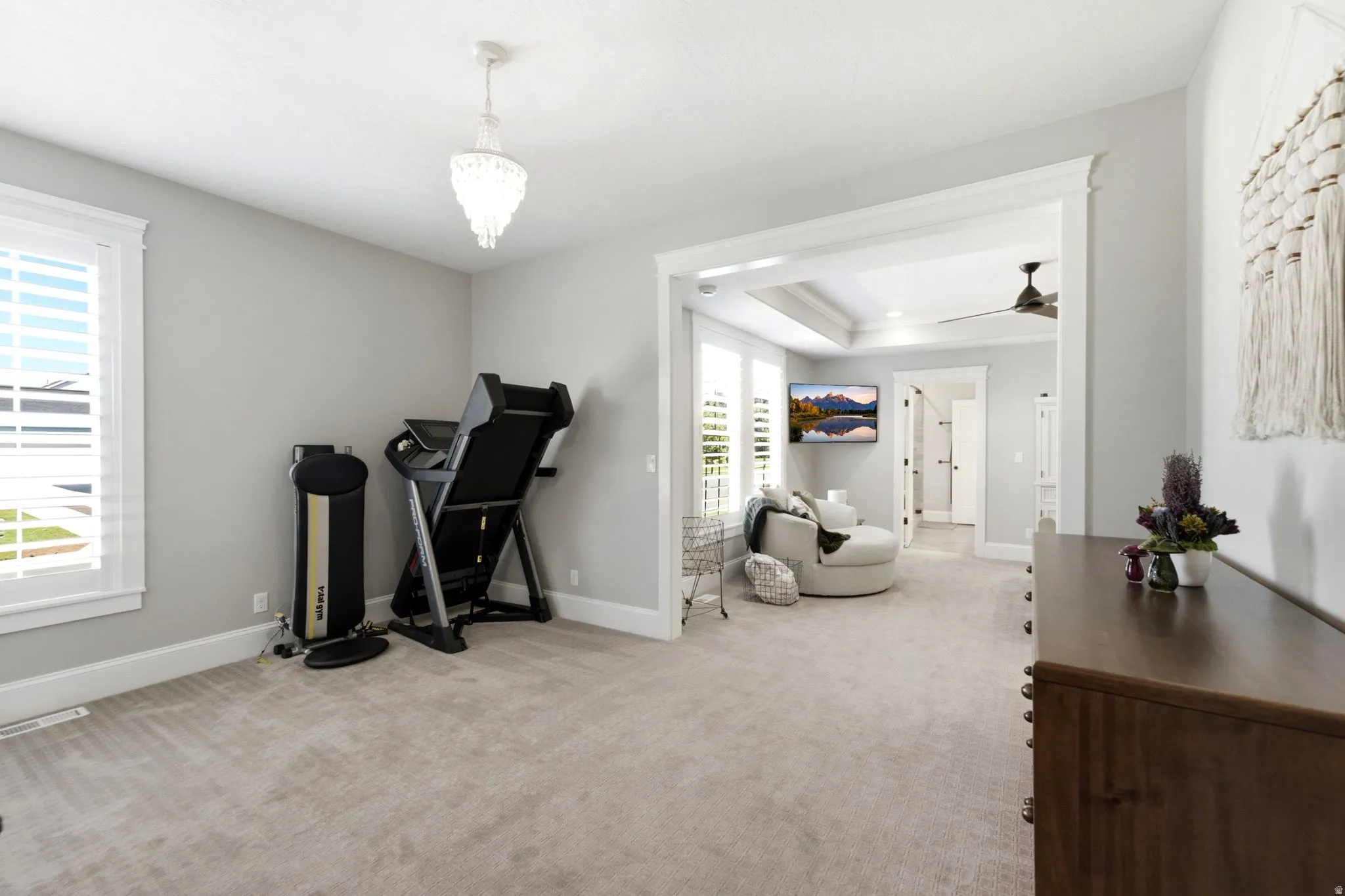 Spacious primary suite features plantation shutters