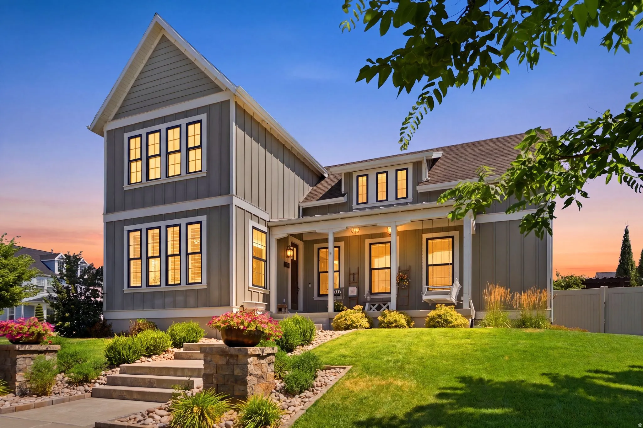 Two-story residence featuring board and batten siding, multiple gables, and a covered porch