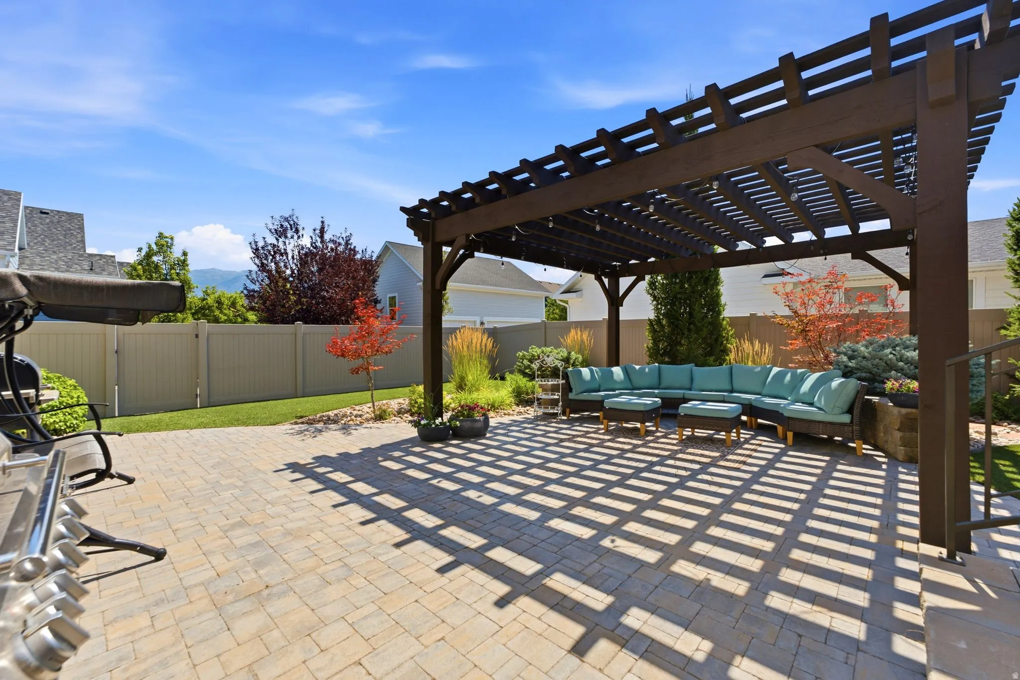 Back patio with pergola and artificial turf
