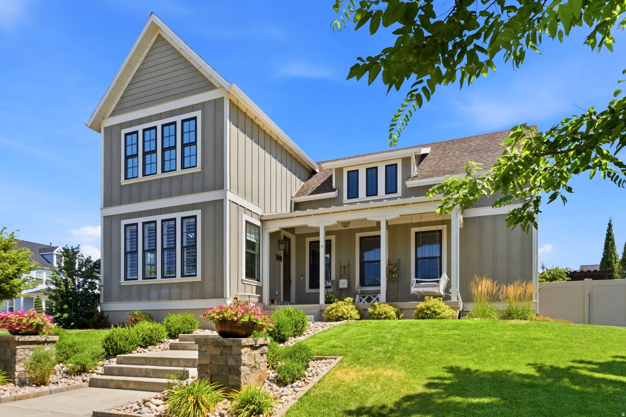 Craftsman-style exterior featuring gabled rooflines and board-and-batten siding