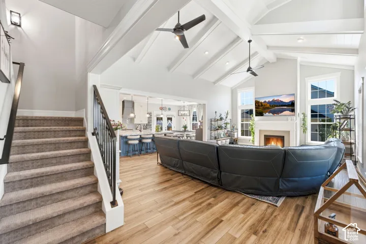 Great room-view of stairs going up and kitchen