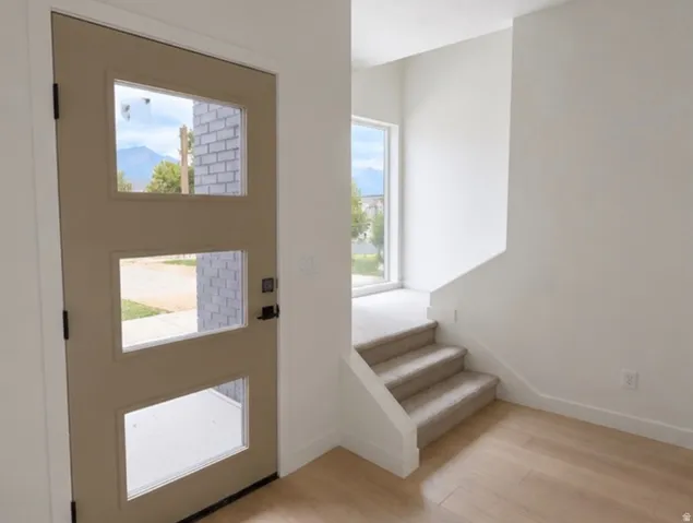 Modern entry door with three rectangular lites and black hardware