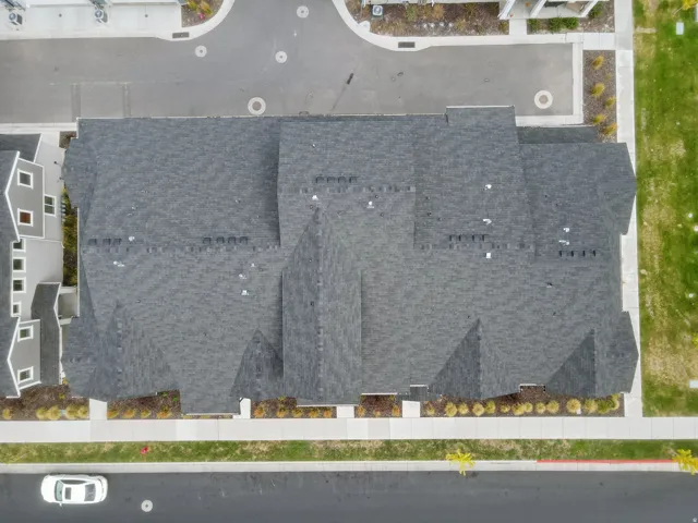 Dark gray shingle roofing with multiple gables