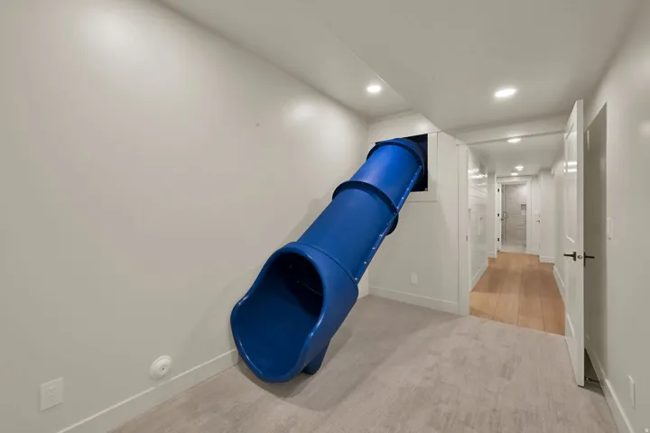 Interior room featuring a built-in blue slide