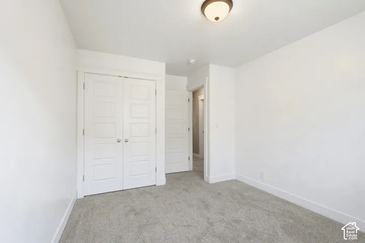 Neutral tone walls complementing gray carpeting