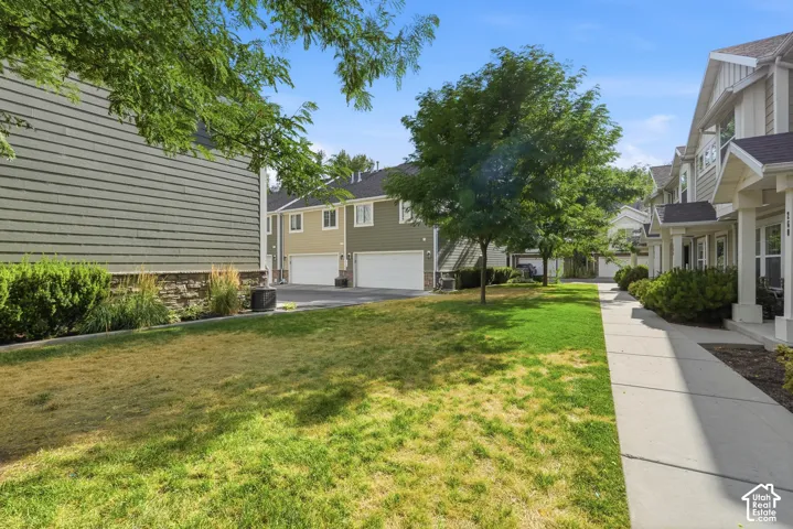 Exterior perspective showcasing a row of residential properties with siding facades